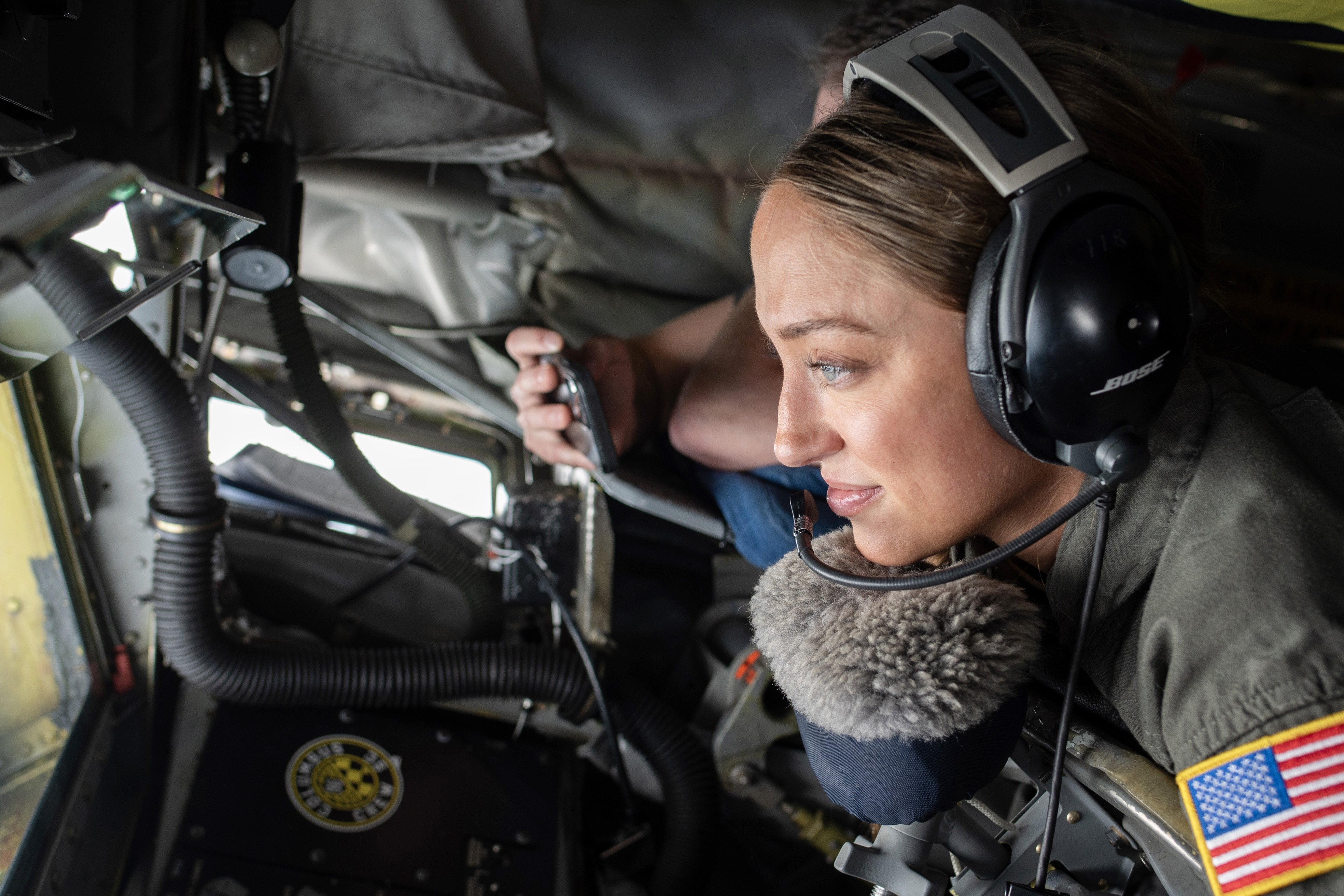Technical Sergeant Morgan Bainer, 121st Air Refueling Wing in-flight refueling specialist, controls boom of KC-135 Stratotanker during in-flight airrefueling of C-17 Globemaster in skies over Columbus, Ohio, June 20, 2024 (U.S. Air National Guard/Alexis Wade)